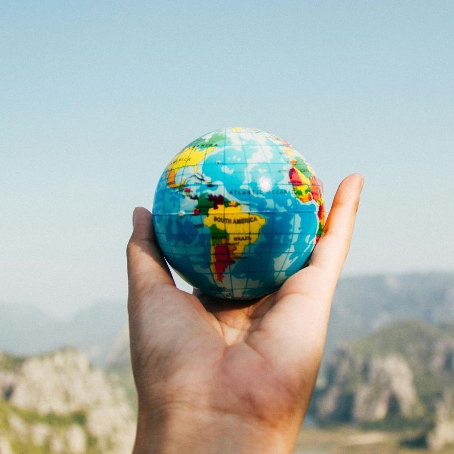 hand holding globe