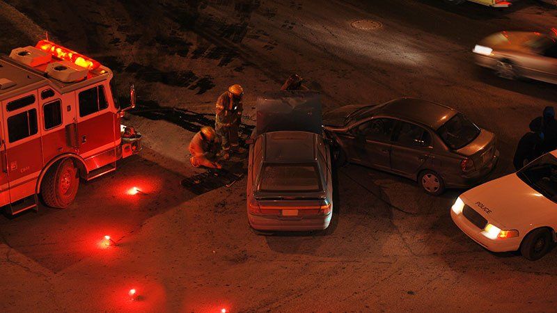 fire fighters being attentive to a car crash