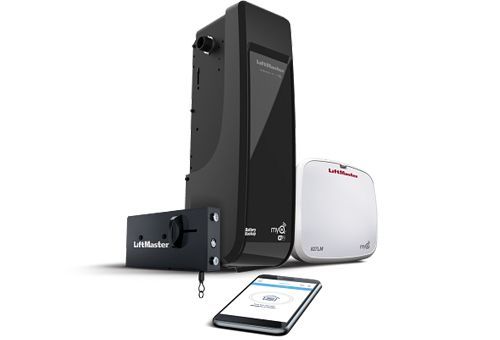 Black wall-mounted device beside a white hub and smartphone on a white background