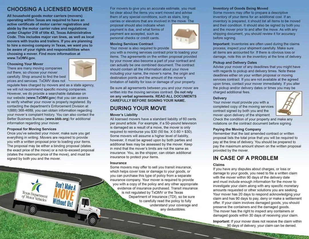 A white moving truck is driving down a road.