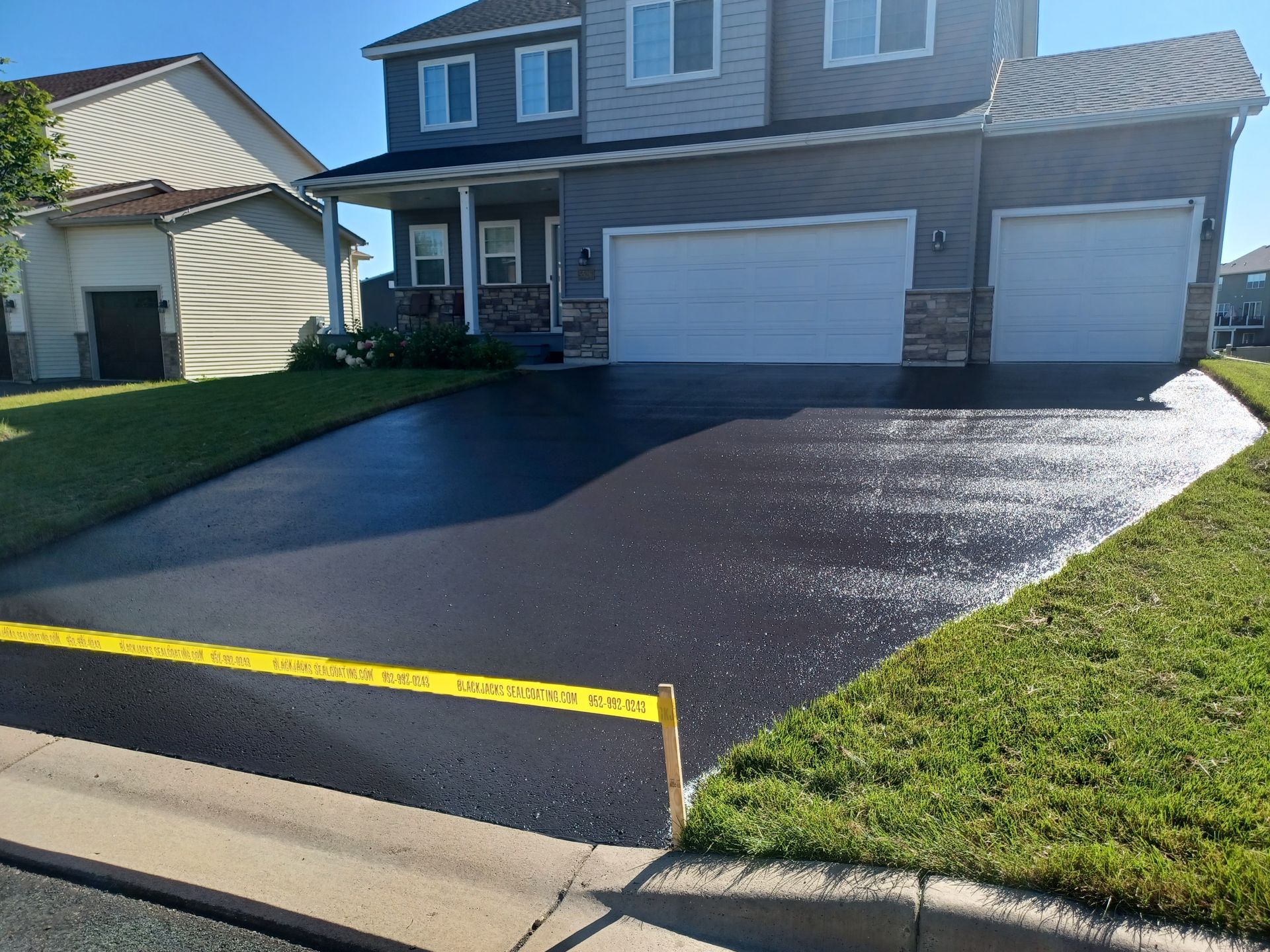 A driveway that has been paved in front of a house