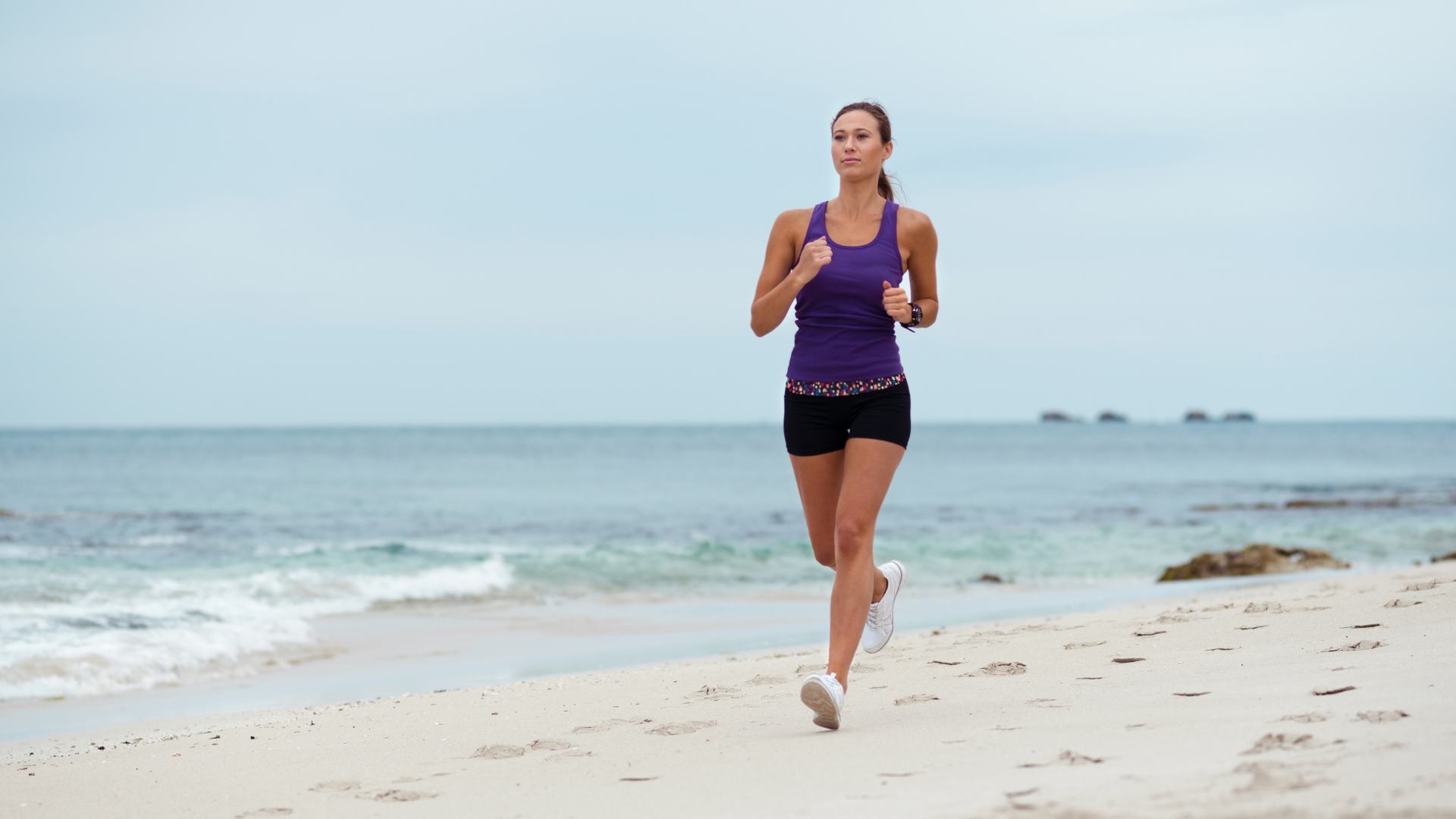 woman running on the beach