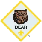 Bear rank badge with a brown bear's face and the word 