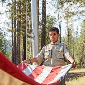 scouts folding an american flag