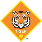 Tiger Cub Scout emblem: orange diamond with tiger face and text 