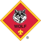Cub Scout Wolf badge with a wolf head, the word 