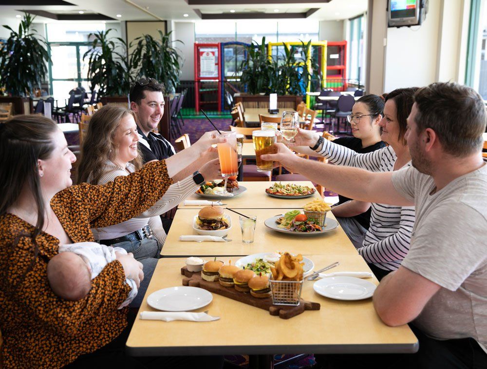 a group of people having a toast at Bertie's Bistro