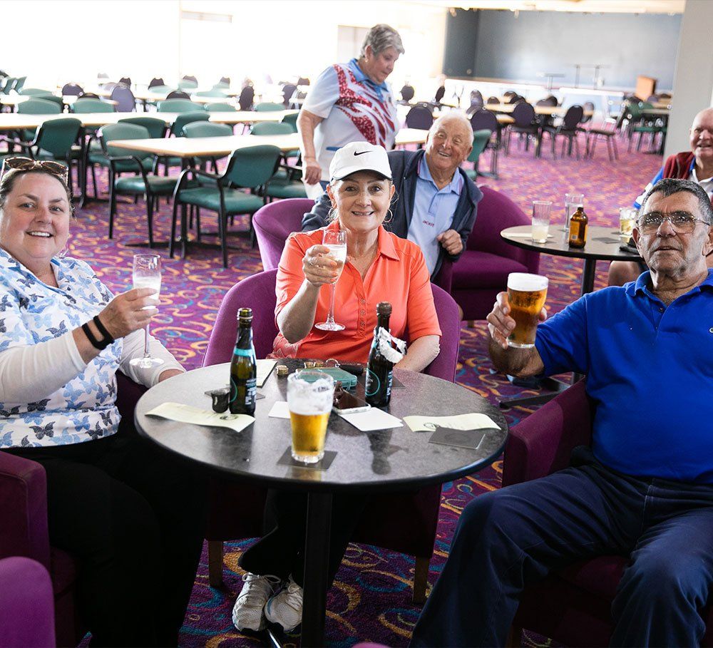 a group of people enjoying some good beer at  Albion Park Bowling Club