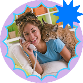 Cablelynx Digital Phone A cat is sitting on a couch talking on a phone