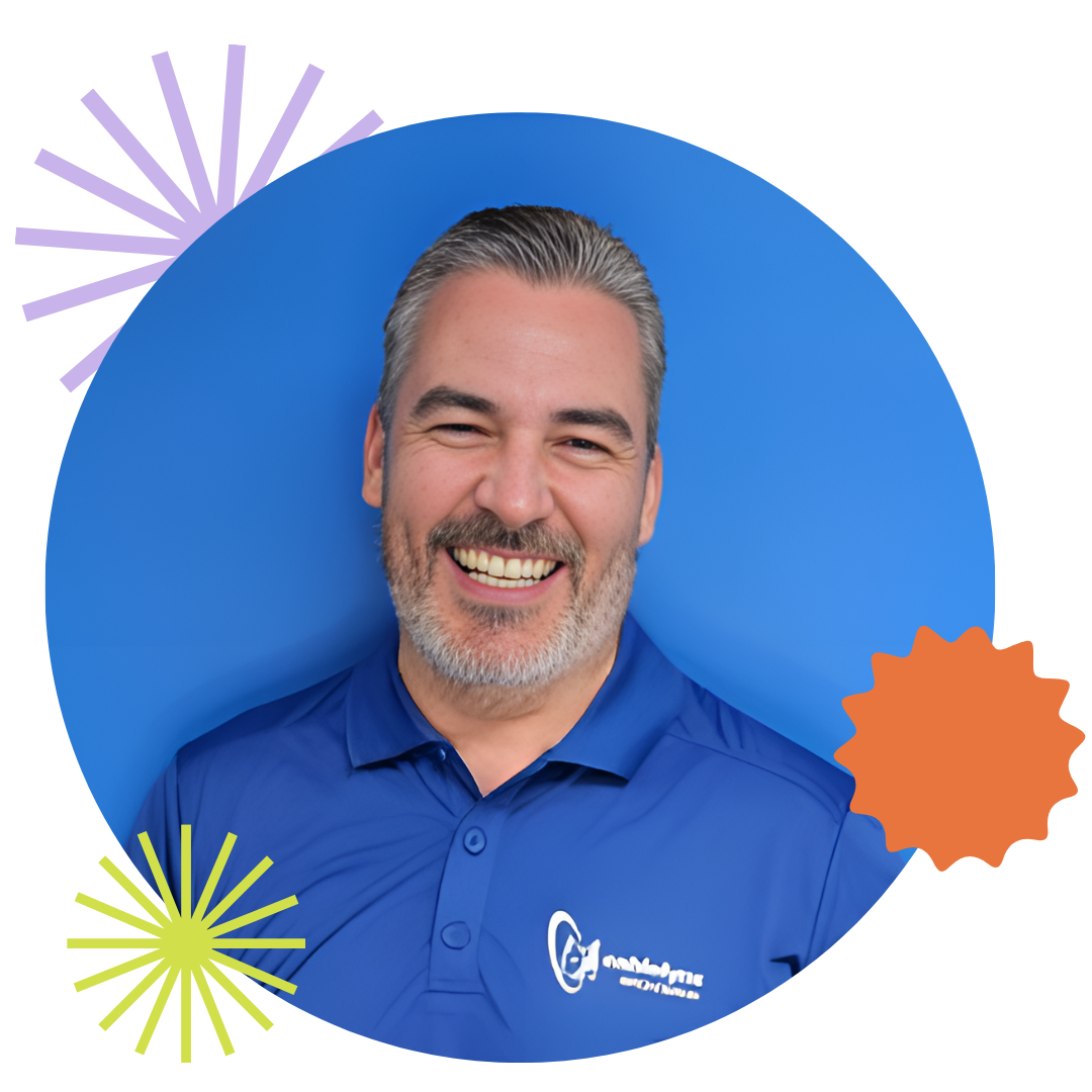 Member of the Cablelynx team smiling at the camera A man in a blue shirt is smiling in front of a blue background