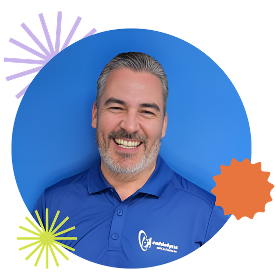 Member of the Cablelynx team smiling at the camera A man in a blue shirt is smiling in front of a blue background