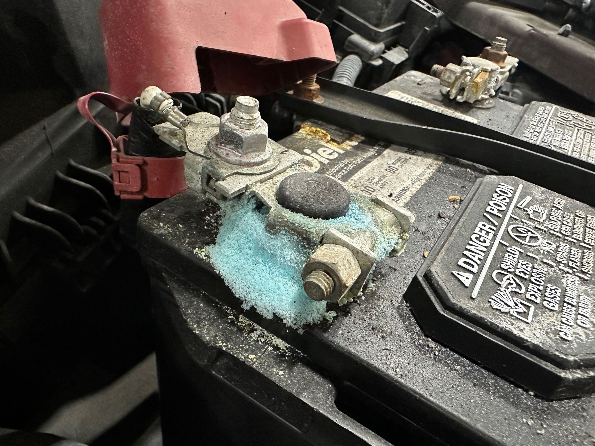 Corrosion on vehicle battery terminal | Lou's Car Care Center, Inc.