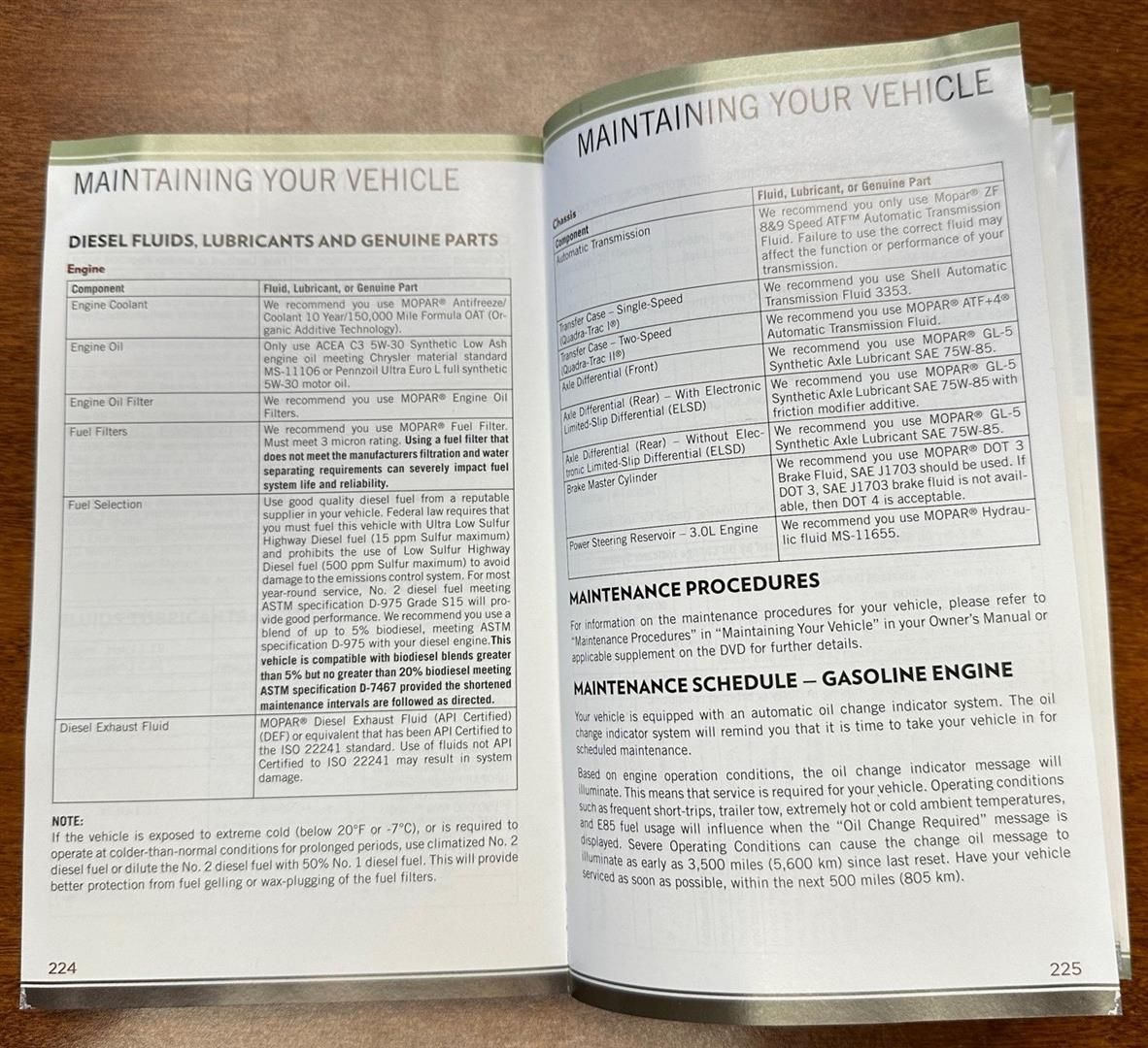 A book is open to a page about maintaining your vehicle | Lou's Car Care Center, Inc.