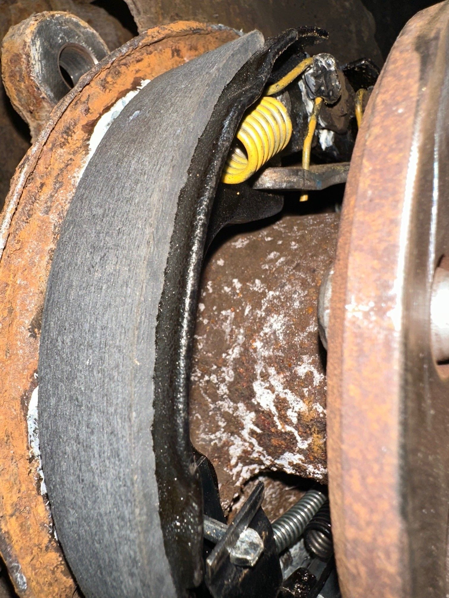 Close up of rusty parking brake shoe on vehicle | Lou's Car Care Center, Inc.