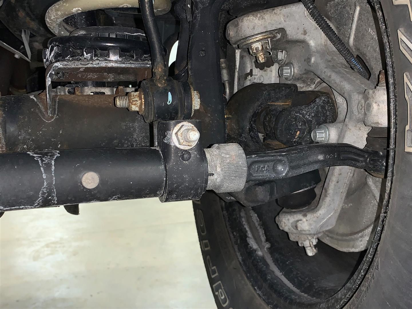 A close up of the front suspension of a car. | Lou's Car Care Center Inc.