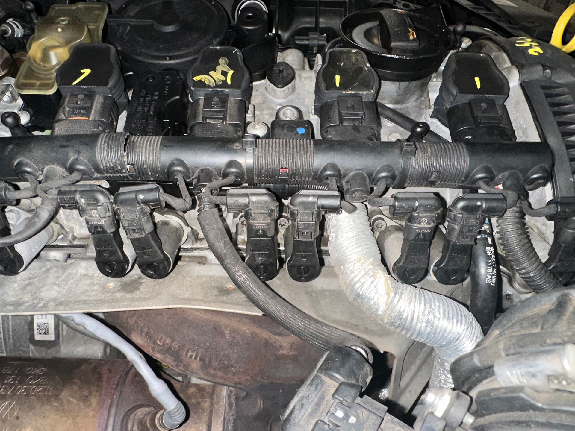 Vehicle fuel injectors in car in shop | Lou's Car Care Center, inc.
