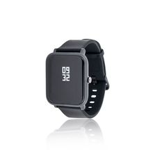 A black smart watch with a reflection on a white background