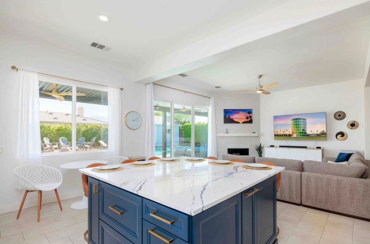 Open-concept kitchen with a blue island