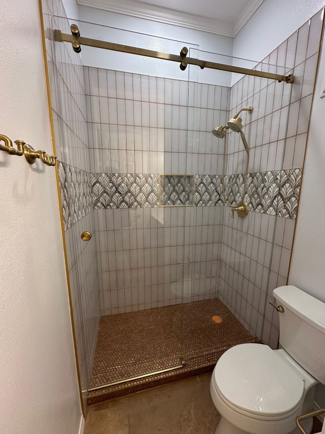 Shower stall with light-colored tile