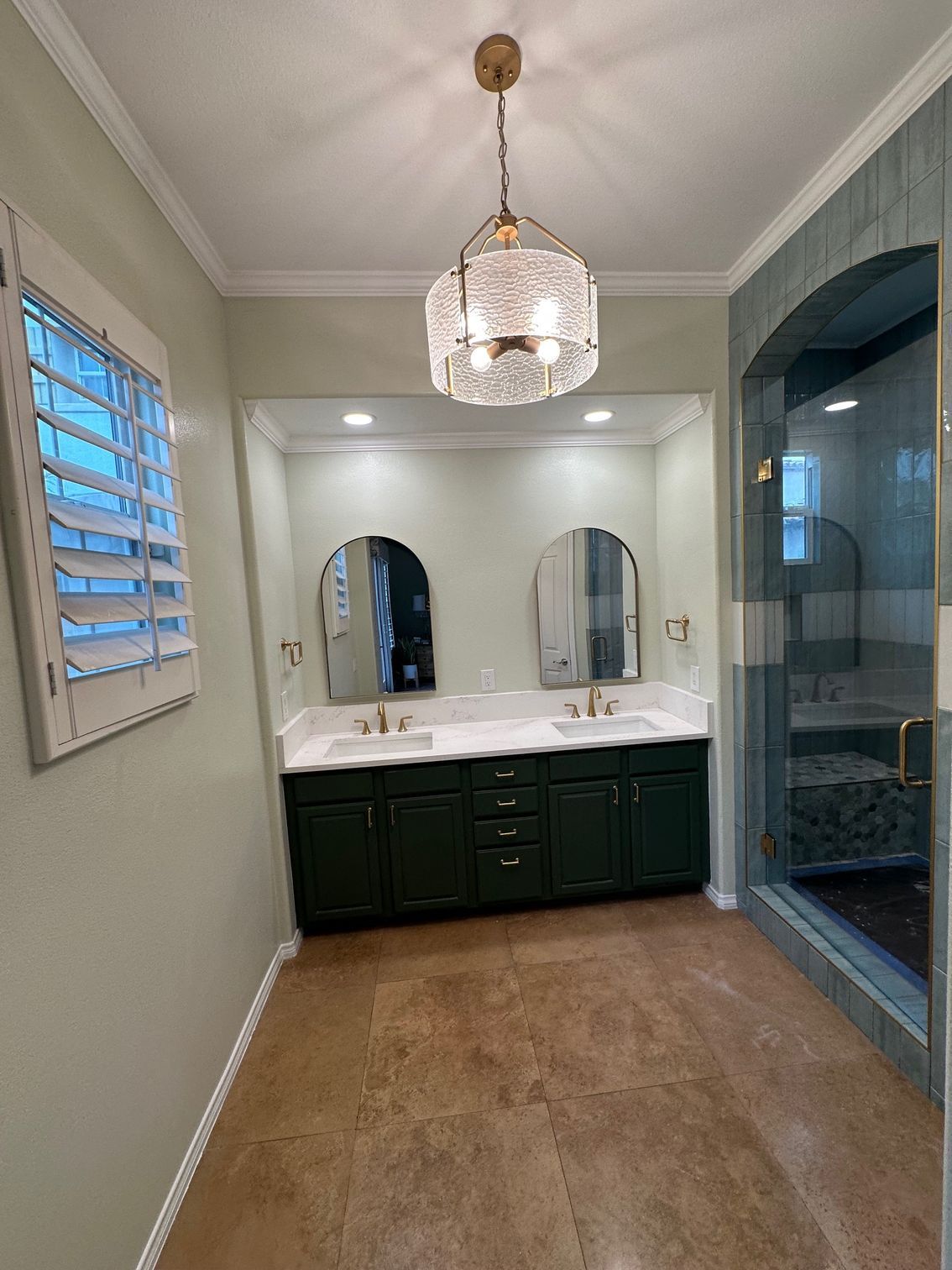Bathroom with dark green vanity