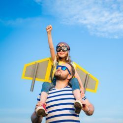 man with child on shoulders, not in pain