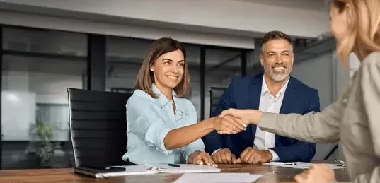 Agreeing to partner with a handshake.