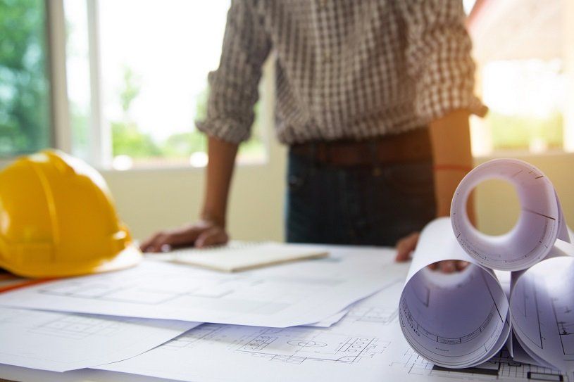 Engineering worker looking at drawings