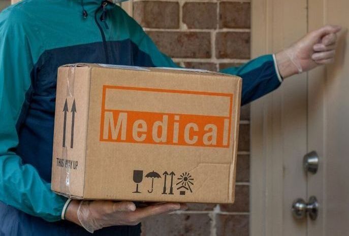 Doctor Typing on Laptop — Arlington, TX — Pronto Courier Delivery and Logistics