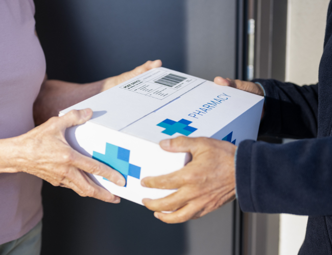 Doctor Typing on Laptop — Arlington, TX — Pronto Courier Delivery and Logistics