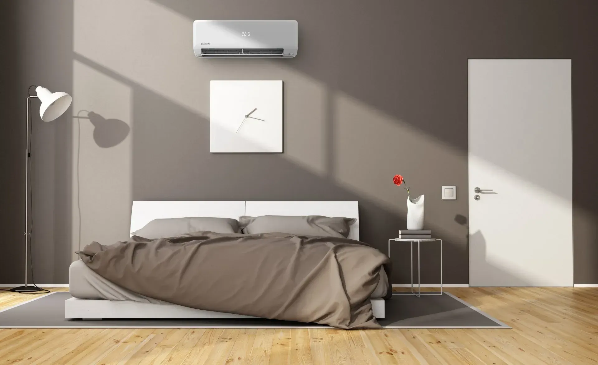 Minimal bedroom with a low bed, wall art, air conditioner, side table, and white door.