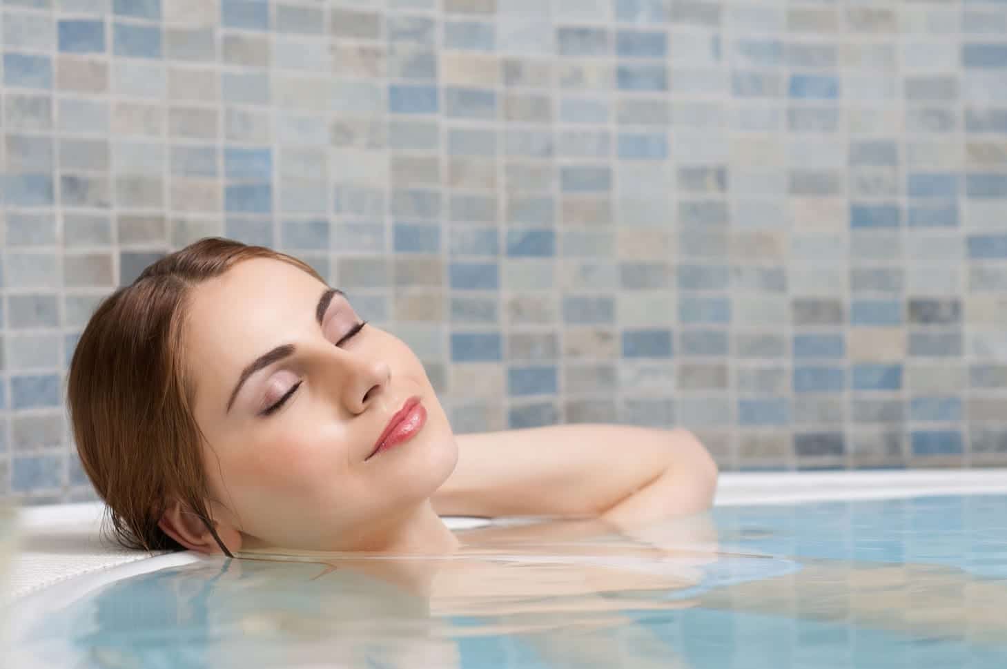 Woman Relaxing in a Bathtub — Yorktown, VA — Anchor Pools & Spas Woman Relaxing in a Bathtub — Yorktown, VA — Anchor Pools & Spas