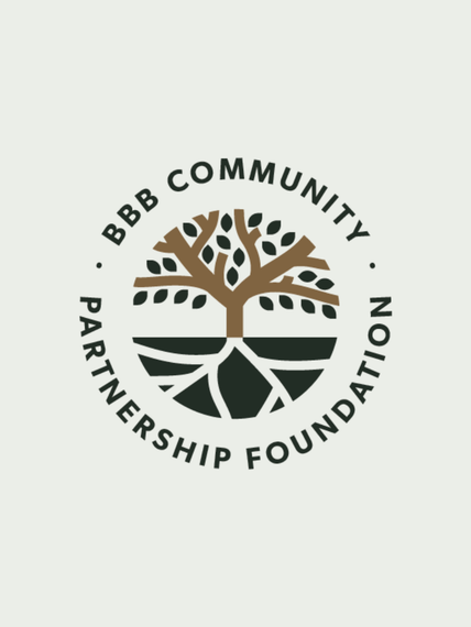 Logo of the BBB Community Partnership Foundation featuring a tree with roots and circular text around it.