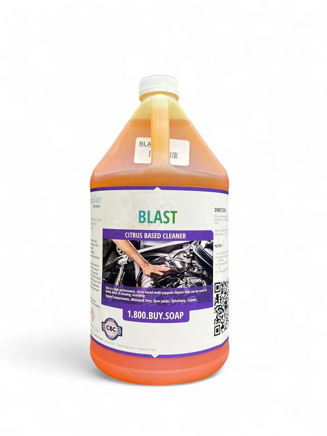 Orange plastic jug labeled “BLAST” with a purple grape graphic and yellow cap on white background