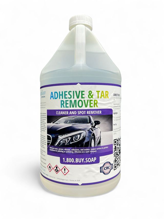 Plastic gallon jug labeled “Adhesive & Tar Remover” with purple and black label.