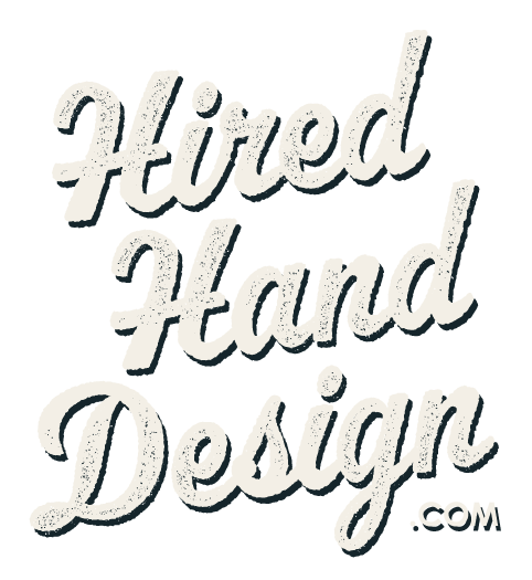 Logo reading “Hired Hand Design” in gray cursive text with a small .com mark
