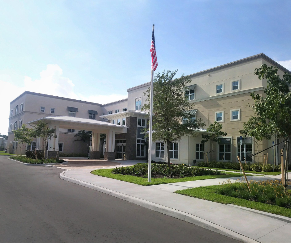 A large building with a flag in front of it
