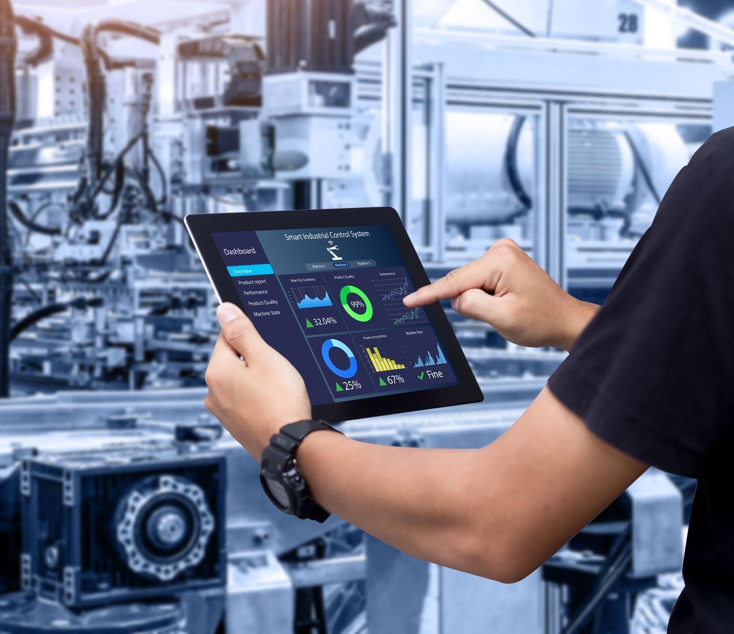 a man is holding a tablet in front of a machine in a factory .