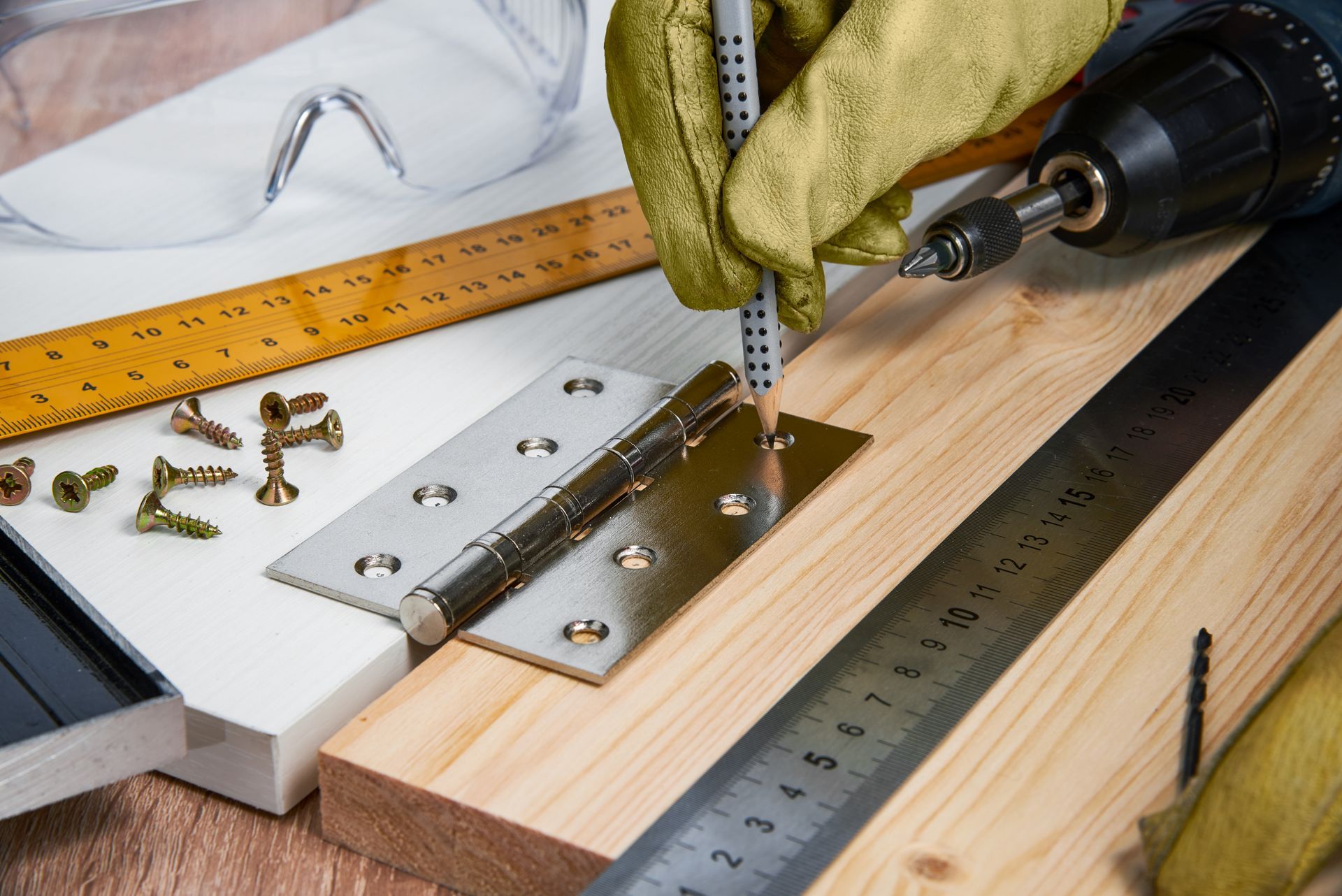 a person is using a drill to drill a hole in a piece of wood