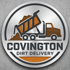 A circular logo with a dump truck pouring dirt on a brushed metal background, featuring the text "COVINGTON DIRT DELIVERY."