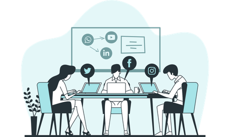 Team collaborating at a table with laptops and social media icons on a screen behind them.