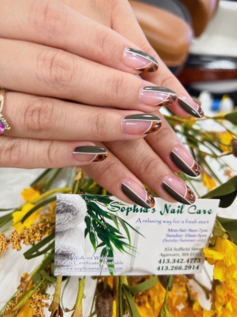 a woman 's nails are displayed next to a business card for sophia 's nail care