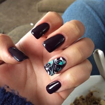 a close up of a person 's hand with purple nails .
