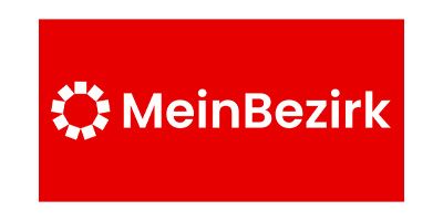 MeinBezirk-Logo auf rotem Hintergrund mit weißem Text und kreisförmigem Symbol