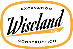 Wiseland Co. excavation and construction logo in black and orange on white background