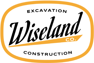 Wiseland Co. excavation and construction logo in black and orange on white background