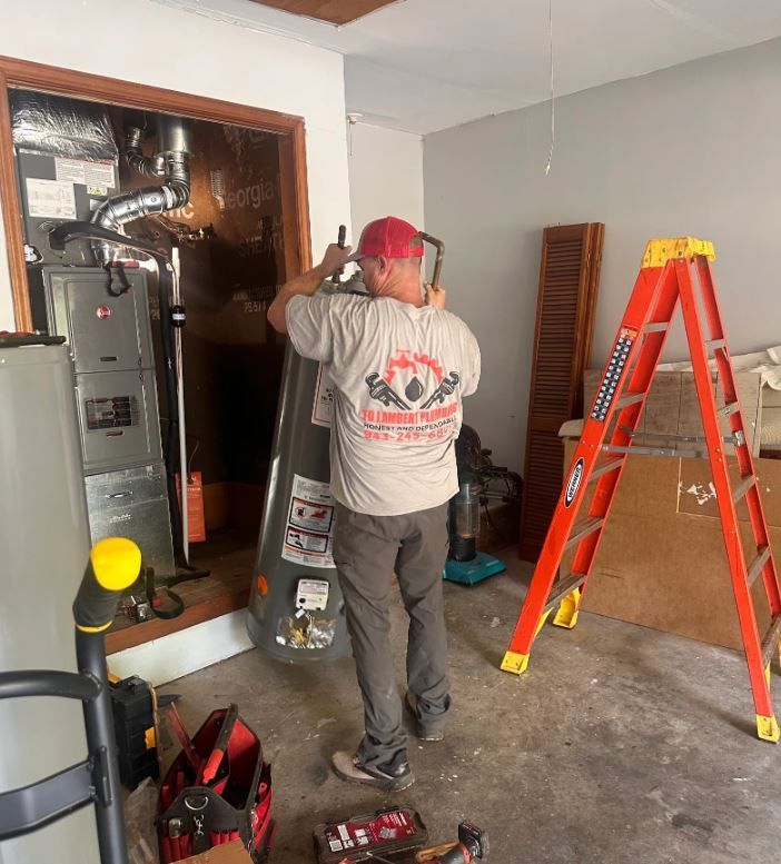 TD Lambert plumber performing water heater reapir