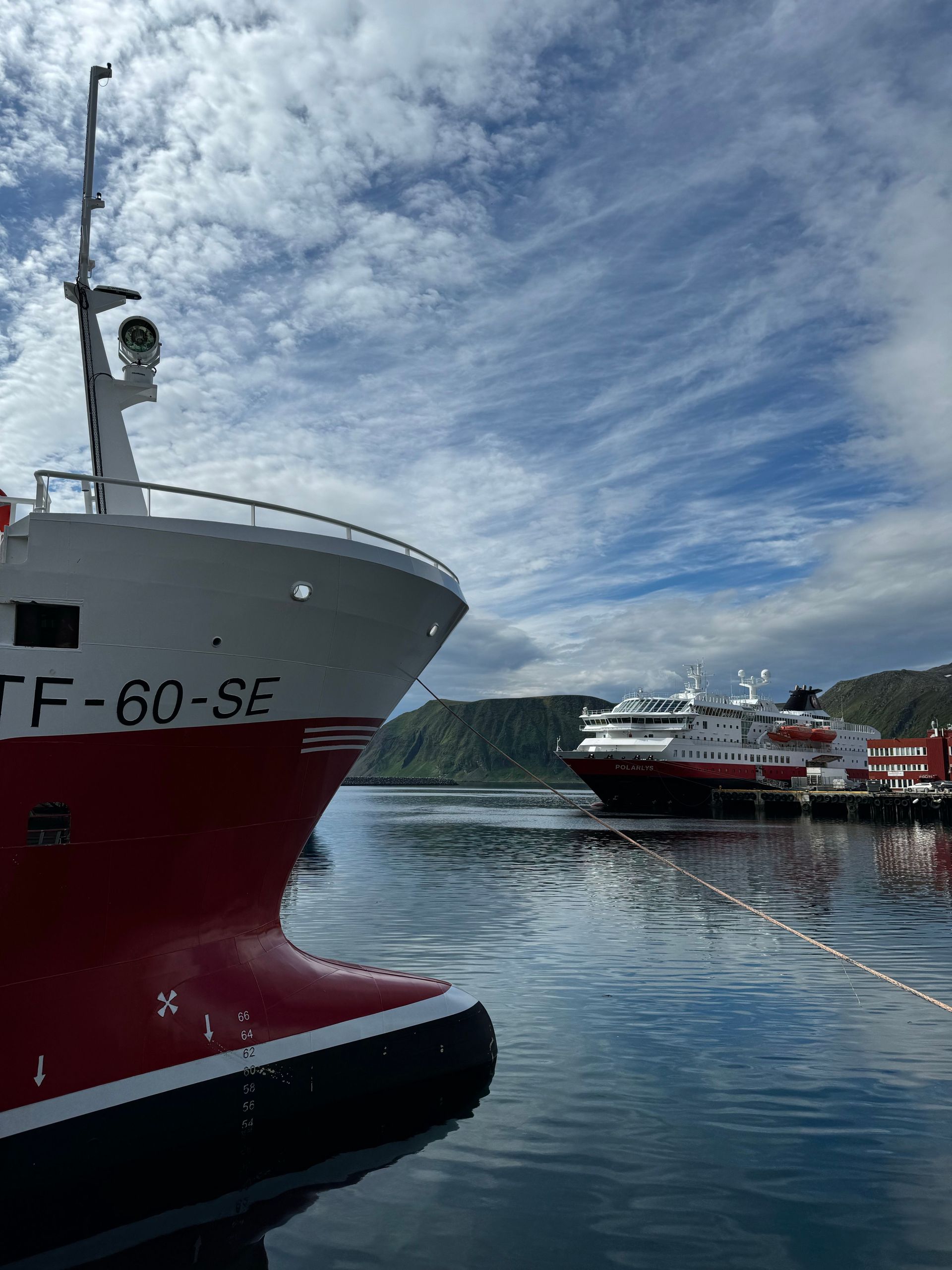 Hurtigruten ship unloading cargo in port