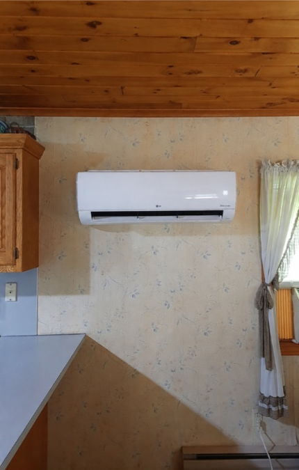 Rusty ceiling vent above a speckled wall, with dark grime and possible mold buildup