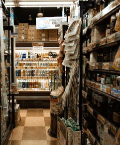A grocery store aisle with a sign that says freshness