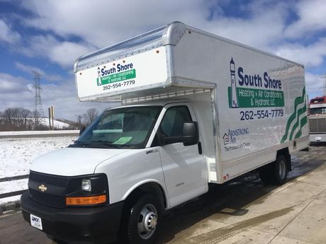 Man Repairing Heat Pumps — Franksville, WI — Energy Expediters